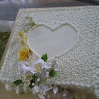 White Cake Double Layer Moist Chocolate Cake with buttercream icing and sugar paste flower for wedding.