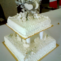 Two Tiers Wedding Cake This is a 4kg two layer moist chocolate cake with butter cream icing and fondant & sugar paste deco. Love doing it but should have put...