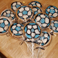 Blue/black Soccer Ball Cookies Soccer ball cookies made for my son's soccer team on his 5th birthday. Their team colors in royal icing and "5".