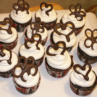 Chocolate Heart/flower Cupcakes Cupcakes with whipped icing and chocolate hearts/flowes made for mom's game night.