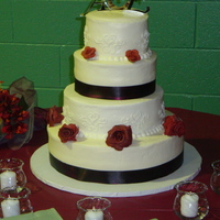 Burgundy Rose Wedding Cake Made for my cousin and his bride. bottom layer was WASC w/ black raspberry filling, middle was marble cake w/ chocolate hazelnut filling,...