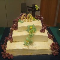 Img_3513.jpg 60th Birthday Cake for our Pastor! Top two layers are almond-hazelnut cake with pistachio buttercream filling, and the bottom layer is...