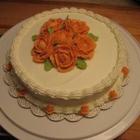 Img_1316.jpg My 4th cake. Also Wilton class 1st course. My very first roses, they far from perfect, but as a first-timer I was proud!