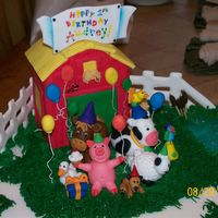 It's A Barn Yard Birthday! Cake is covered using fondant and all the animals are made of fondant. The barn is a pound cake covered using fondant and the fence was...