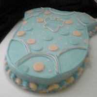 Baby Onesie This was a quick cake for a friend who went into labor at her baby shower. The cake is just one layer white chocolate. We brought the mom...