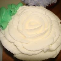 Rose Cupcake Just messing around to see if I could pipe a rose "directly" onto a cupcake like I would a nail...it turned out ok
