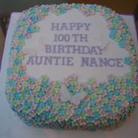 100Th Birthday Cake Covered In Flowers 