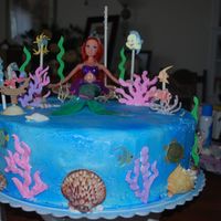 Little Mermaid Cake this is home made buttercream frosting spray painted blue .. I used real sea shells bought at the store and some scrapbooking stickers..see...