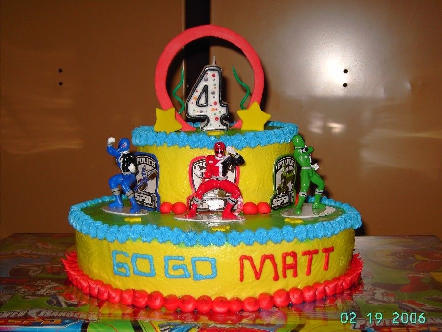 Power Rangers Made for my son's 4th birthday. Funfetti cake, buttercream icing, MMF accents. Figures were a purchased cake topper kit. Taken at the...