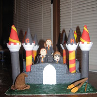 Harry Potter harry potter and ron and hermine all in a castle. The sorting hat and the snitch is on the side, also brooms and wands.