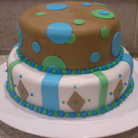 2 Tier Geometric Shapes done for my nephews 1st bday. all fondant accent w/ buttercream border.