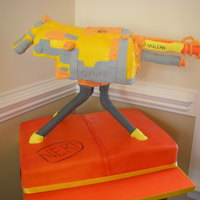 Vulcan Nerf Gun PVC armatures first doing something like this. for my sons 5th bday all fondant accents. gun is rice krispies with RI over to help smooth...