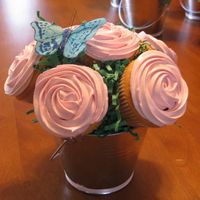 Cupcake Bouquet First cupcake bouquet, vanilla cupcakes made with strawberry bettercreme.Found the little tins at Michaels, only a $1. For the center, used...
