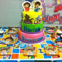 Dora And Diego Shared birthday party for brother and sister. Friends are fondant and dora and diego are painted on gumpaste