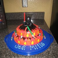 Darth On Fire Similar to on fire cake-tinted choc buttercream/fondant flames/Light sabers are actually molded out of clay.