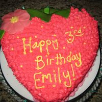 Strawberry Decorated in cream cheese frosting/leaf, stem, and flower are melted starbursts