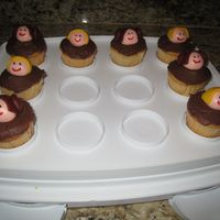 Star Wars Cupcakes 1st time making fondant people. MMF Luke and Leia heads, rest is chocolate frosting.