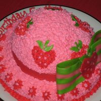 Strawberry Shortcake Hat 1st decorated cake ever. Yellow cake with strawberry filling and buttercream frosting. Bow and hat band are melted starbursts. TFL!