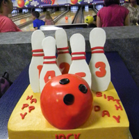 Jack Jack's Birthday Chocolate cake with double chocolate fudge filling covered in vanilla buttercream. Bowling pins are sugar cookies with royal icing. Bowling...