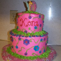 Kora's Tinkerbell Cake BC with MMF accents. The tinkerbell topper was bought at Michaels. I saw it there after my last tinkerbell cake, and figured it would be...