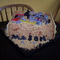 Mason's Tool Box Cake This was suppose to be a tool box cake inspired by Macsmom. Didn't turn out quite right, but it still was alright. Some of the tools...