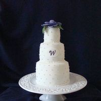 Elizabeth_018.jpg Chocolate/vanilla cake, swiss merengue filling, dragee/fondant flower accents.