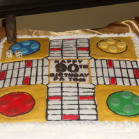 Parchessi Cake I made this for my dad's 90th birthday because he loved playing the game. It is a orange pound cake with butter cream frosting....