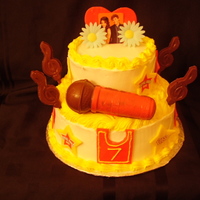 High School Musical Made this cake for my little cousin. added some chocolates to it. was a really fun cake to make