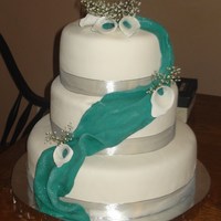 Teal And Silver Wedding Cake I made the calla lilies to match the teal fondant swag. Wasn't sure how this was going to look but I think the bride will like it. All...