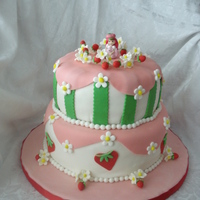 Strawberry Shortcake 8" and 10" tiers WASC with IMBC and fondant. Only non edible is Ms. Strawberry herself. Lots of fun to do and girly. TFL!