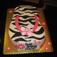 Hawaiian Flip Flop Cake Carved from a half sheet pan. Decorated with buttercream and fondant/gumpaste accents. This cake is special to me because it was for a gal...