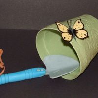 Garden Supplies This is gumpaste flower pot, shovel & butterfly that I made. I'm going to put it on my moms retirement cake.