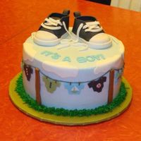 Clothesline Baby Shower Cake This is my first clothes line cake, I did it for a friend. The mom wanted some black in it. thanks for lookingcake is covered in...