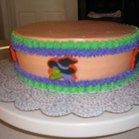 Birthday Cake This is a Birthday cake. I found Halloween lollipop of weird figures and I stick on top off it. Everyone love the cake.