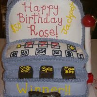 Slot Machine shaped cake then icing is butter cream used some choc melted and shaped also used some fondant