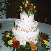 Fall Fantasy This was a stacked round cake witha 14", 10" and an 8" on top. The cake was iced with Buttercream Icing and the bride...