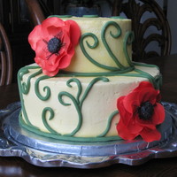 Poppies Two tier yellow buttercream cake with gumpaste poppies and fontant vines. Thanks for looking!