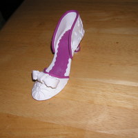 Wedding Shoe I made this shoe out of gum paste and fondant. I used the Wilton flower impression matThank you for looking