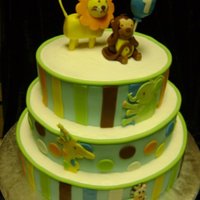 Brody's 1St Bday 1st Birthday Cake and matching smash cake. Made to match plates and napkins. Iced in Buttercream, sides covered in fondant. Figures are RKT...