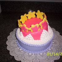 Princess Cake Chocolate cake with buttercream with fondant and gum paste decorations.