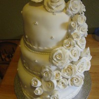 Wedding Cake My first wedding cake. I still have a lot to learn when dealing with fondant, I just get frustrated when I cannot make it all smooth. I...