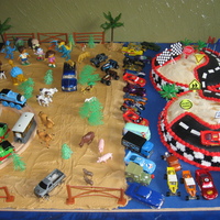 Race Track Cake I made this cake for my 3 year old son. He loves cars, but also loves Diego, Dora and Boots and Thomas and his friends. I decided to make a...