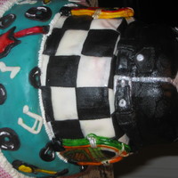 Rock -N- Roll This was a cake I did for a 70th B-day party with a Rock -n- Roll/ 50's type theme. It's a 3 tier stacked cake. The top tier is...