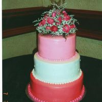 Hot Pink Wedding Cake 3 tier wedding cake,all cherry-chip real cake,butttercream icing, fondant balls top trinm edges,real roses from florist to top. Realized...