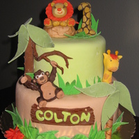 Jungle Funfari French vanilla sour cream cake with vanilla custard filling covered in MMF for a first birthday. All decorations are MMF. Made to resemble...