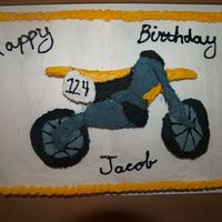 048.jpg This was a birthday cake I done for a client. I used a template to carve the dirt bike out of cake and then iced it.