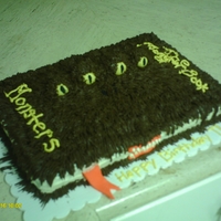 Harry Potter Monster Book Of Monsters Yellow cake w/ chocolate frosting. The eye's are fondant.