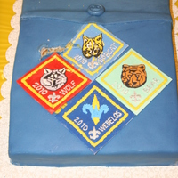 Cub Scout Pocket This was made for a 2010 Cub Scout Blue and Gold banquet. The patches are fondant and royal icing. Unfortunately, my daughter fell on the...