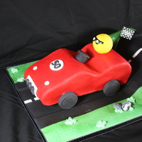 Over The Hill And On A Roll Cake Hill and car is vanilla cake filled with raspberry SMBC, Head is styro ball covered in yellow fondant