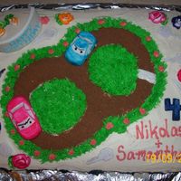 The Race Track Cake Well here it is. Everything on the cake is edible. It is just missing the flag, I didn't want to put it on just on just case it fell...